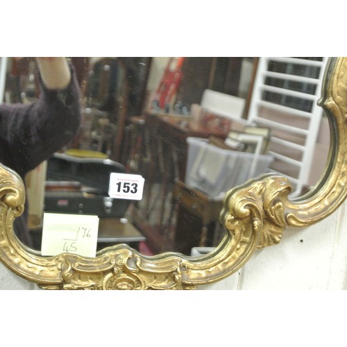 153 - Regency design gilt framed shaped wall mirror with scroll decoration H77 x 45 cm