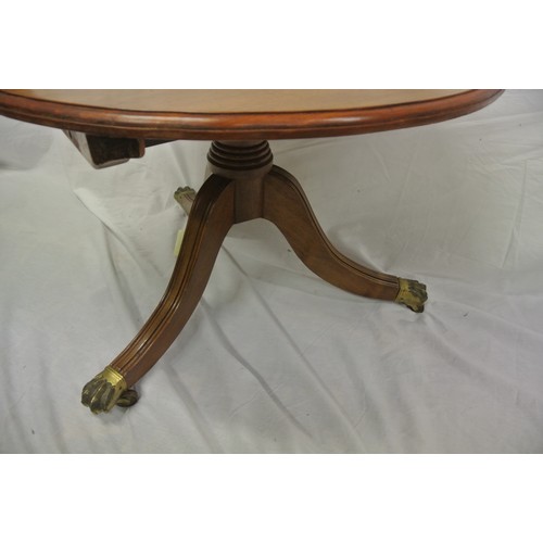 159 - Victorian mahogany round coffee table with baluster column, on reeded splayed tripod with brass lion... 