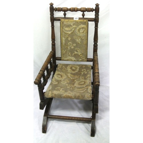 389 - Victorian childs rocking armchair with turned rails & arms, on bracket feet