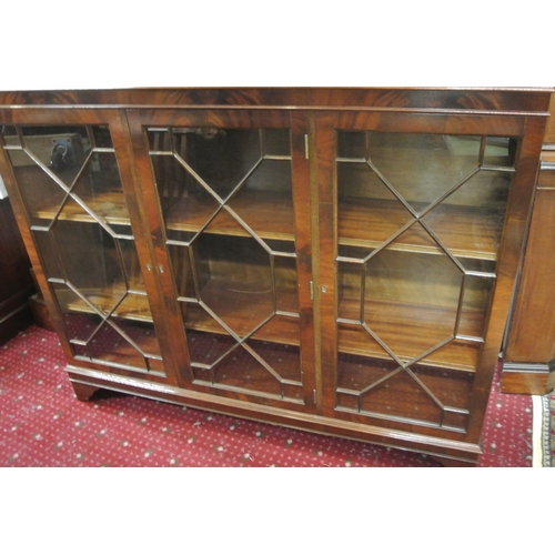 55 - Edwardian style triple bookcase with astragal glazed doors, shelved interior, on bracket feet