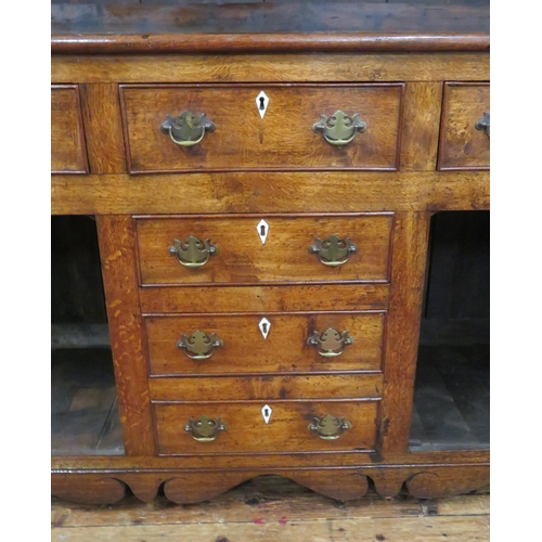 70 - Victorian oak dresser with dentil frieze, shelved back with plate rails, numerous drawers & presses ... 