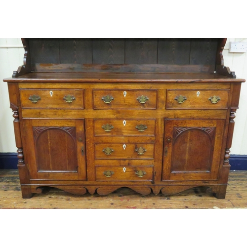 70 - Victorian oak dresser with dentil frieze, shelved back with plate rails, numerous drawers & presses ... 