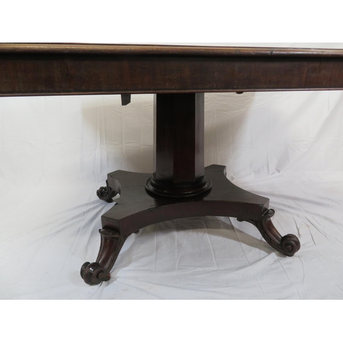 185 - Victorian mahogany dining or library table with tip-up top, hexagonal tapering column with round col... 