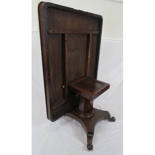 185 - Victorian mahogany dining or library table with tip-up top, hexagonal tapering column with round col... 