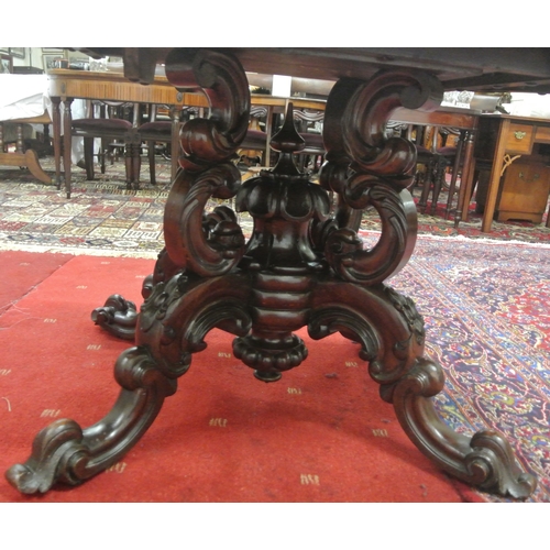 200 - Victorian walnut centre or library table with serpentine shaped sides, raised on ornate carved shape... 