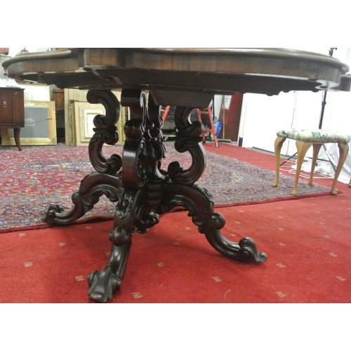 200 - Victorian walnut centre or library table with serpentine shaped sides, raised on ornate carved shape... 