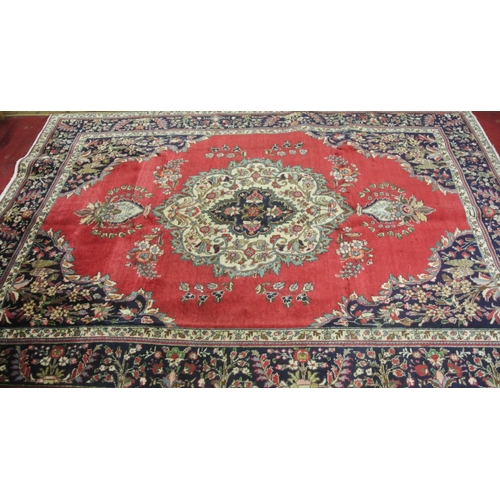 254 - Blue and red ground Persian Tabriz carpet with traditional medallion design. 290x 200cm