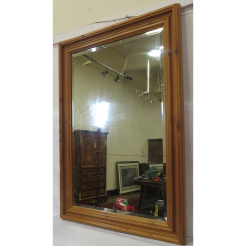 132 - Pine framed bevelled glass wall mirror108x78cm