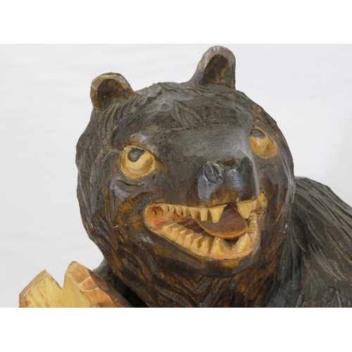 143 - Austrian style carved timber figure of a Black Forest bear by a tree