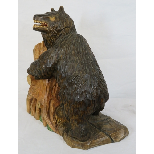 143 - Austrian style carved timber figure of a Black Forest bear by a tree