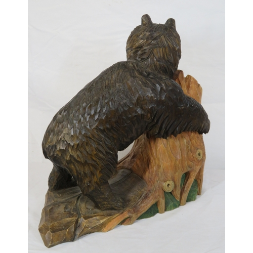 143 - Austrian style carved timber figure of a Black Forest bear by a tree