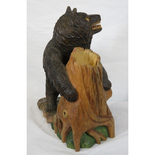 143 - Austrian style carved timber figure of a Black Forest bear by a tree