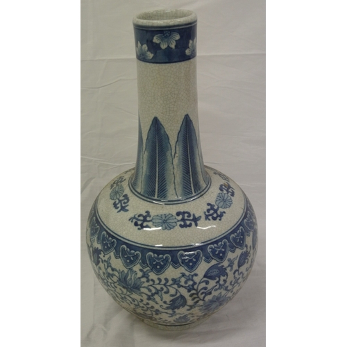 153 - Pair of Oriental style long necked ginger jars with ornate blue & white foliate decoration