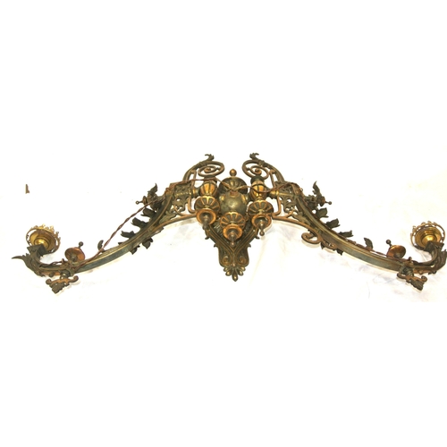 172 - Pair of vintage bronze wall lights, with folding shaped arms, finials, foliate decoration & scroll b... 