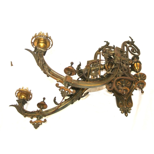 172 - Pair of vintage bronze wall lights, with folding shaped arms, finials, foliate decoration & scroll b... 