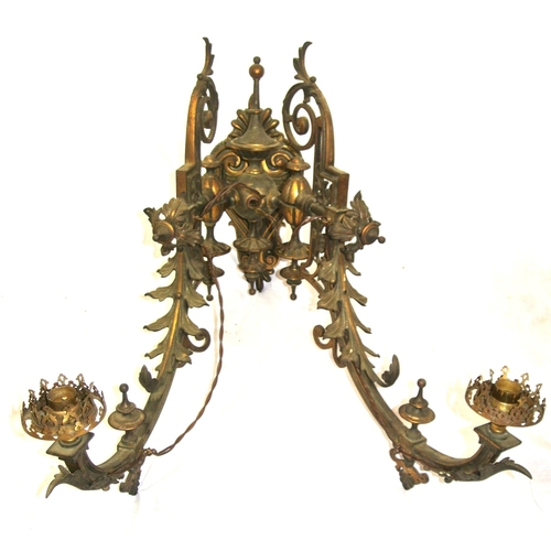 173 - Pair of vintage bronze wall lights, folding shaped arms, finials, foliate decoration, scroll backpla... 