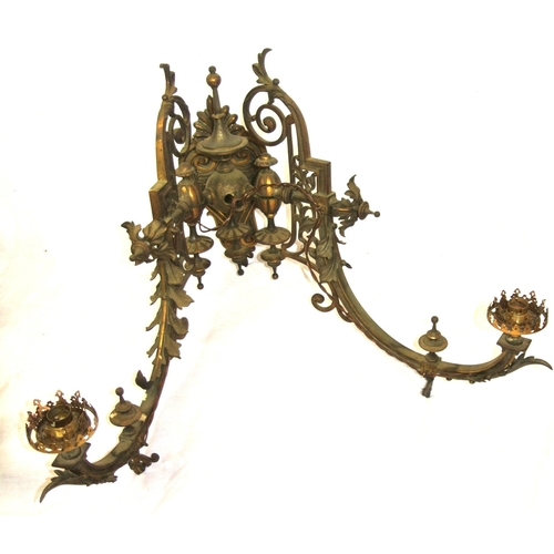 173 - Pair of vintage bronze wall lights, folding shaped arms, finials, foliate decoration, scroll backpla... 