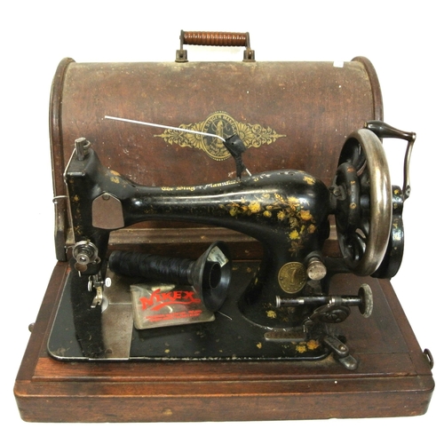 53 - Gilt decorated Singer sewing machine in oak case