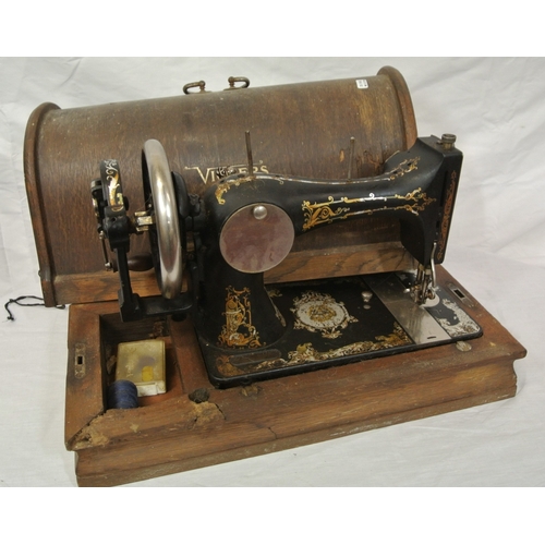 54 - Decorated Vickers sewing machine in oak case