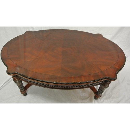 60 - French style oval coffee or occasional table with serpentine borders, reeded frieze and legs with sh... 