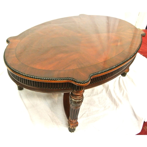 60 - French style oval coffee or occasional table with serpentine borders, reeded frieze and legs with sh... 