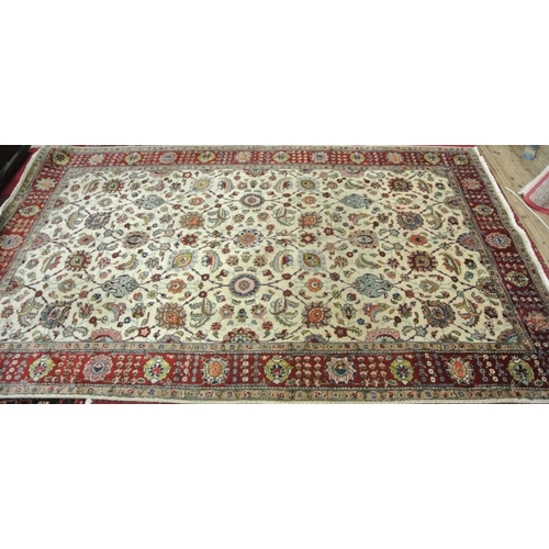 72 - Cream ground Persian rug with all over multi-coloured floral pattern. 300x180cm