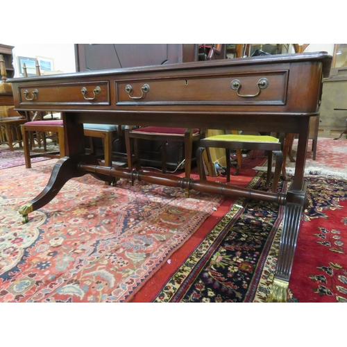 75 - Edwardian design oblong desk with leatherette inset, two drawers with drop handles, shaped columns &... 