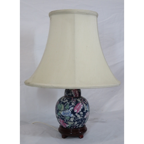 88 - Oriental style porcelain electric lamp with foliate decoration & timber base