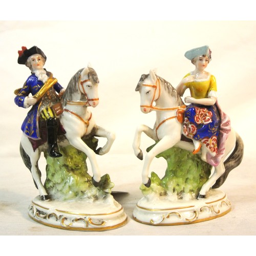 239 - Pair of Chelsea figures of figures on horseback, on oval decorated bases