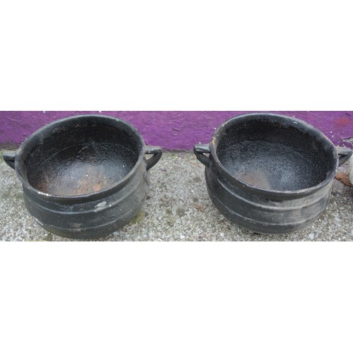 293 - Pair of ball shaped cast iron skillet pots with shaped handles