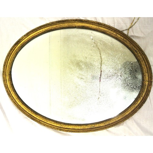 298 - Oval gilt framed mirror with beaded decoration 70 x50 cm