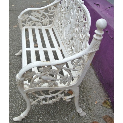 310 - Cast iron garden bench with shaped arms & finials, ornate bird figured & foliate decoration, slated ... 