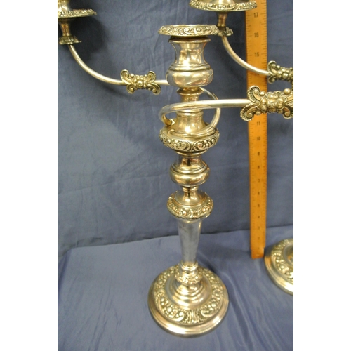 17 - Pair of Sheffield silverplated 2 branch candelabrae with shaped arms, scroll & foliate decoration, o... 