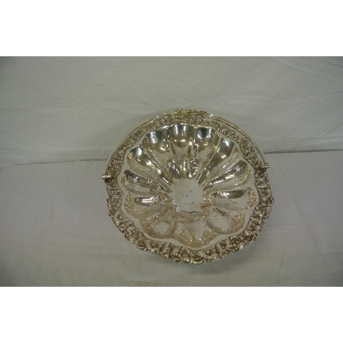 33 - Ornate silverplated cake basket with foliate decoration and shaped swing handle