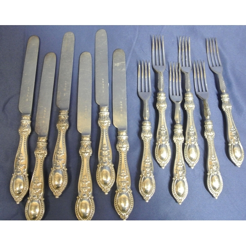 13 - Set of 12 silverplated knives and forks with foliate decorated handles