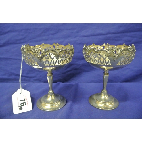 82 - Pair of Birmingham silver stemmed vases with pierced and foliate decoration, on round bases 163g, H1... 