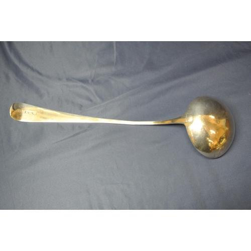 102 - Irish silver ladle with long Old English pattern crested handle, round bowl, by John Power, Dublin 1... 