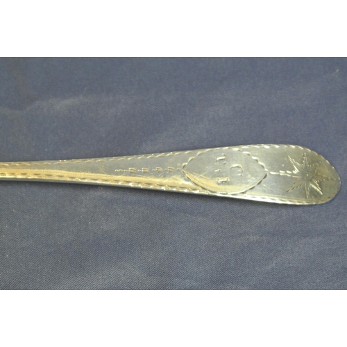 111 - Irish Silver serving spoon with bright cut crested pointed handle, by Michael Keating, Dublin 1795, ... 