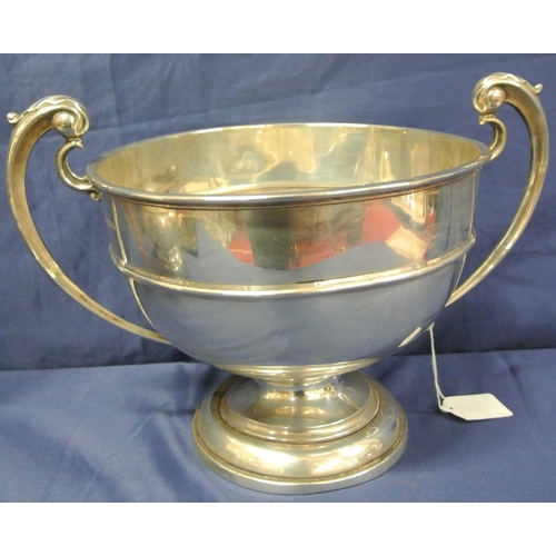 40 - Large London silver trophy cup with shaped handles, on round  spreading base, dated 1923, 684g, 20cm... 