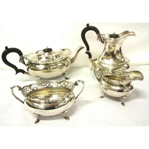 44 - Four piece Birmingham silver tea service of oval baluster form with pierced rims, shaped handles, on... 