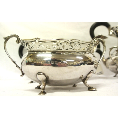 44 - Four piece Birmingham silver tea service of oval baluster form with pierced rims, shaped handles, on... 