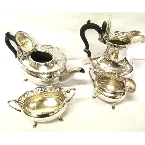 44 - Four piece Birmingham silver tea service of oval baluster form with pierced rims, shaped handles, on... 