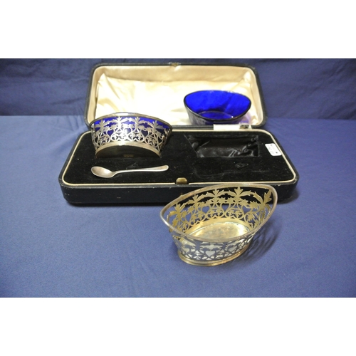 48 - Pair of London silver oval salts with pierced angular sides, reeded rims and blue glass liners, in p... 