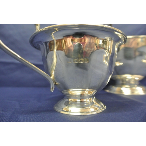 51 - 3 piece Sheffield silver tea service with panelled bodies, shaped handles, on round bases, by Viners... 