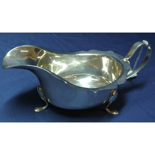 77 - Birmingham silver sauceboat with wavy rim, shaped handle and pad feet, 168g, 18cm