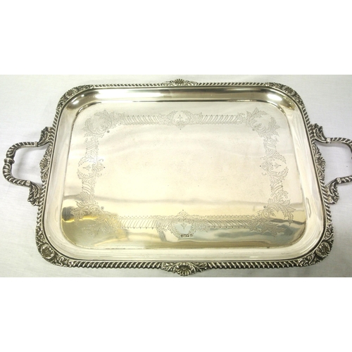 99 - Large George V Sheffield silver serving tray with shell and gadroon borders, shaped handles, foliate... 