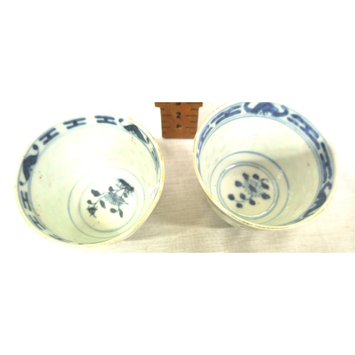 244 - Pair of Oriental blue & white small rice bowls with foliate decoration, 6.5cm d