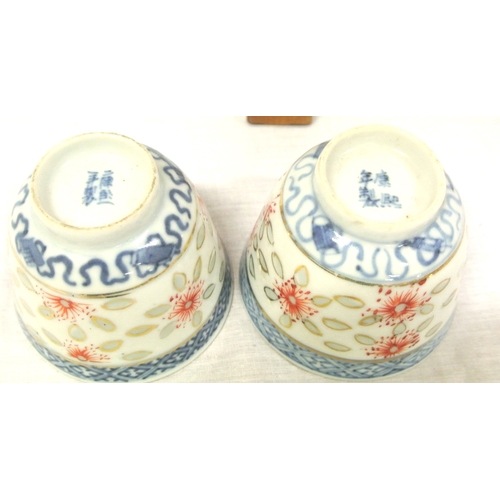 244 - Pair of Oriental blue & white small rice bowls with foliate decoration, 6.5cm d