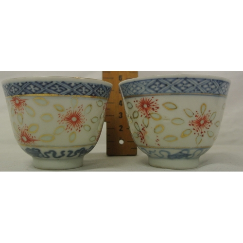 244 - Pair of Oriental blue & white small rice bowls with foliate decoration, 6.5cm d