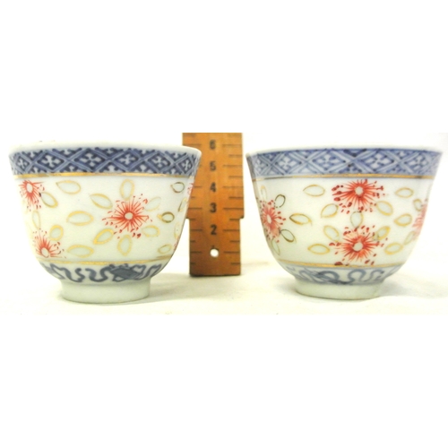 244 - Pair of Oriental blue & white small rice bowls with foliate decoration, 6.5cm d